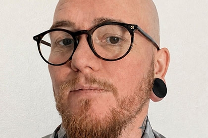 Headshot of Aedan Wolton,  strategic lead of equality, Sport England